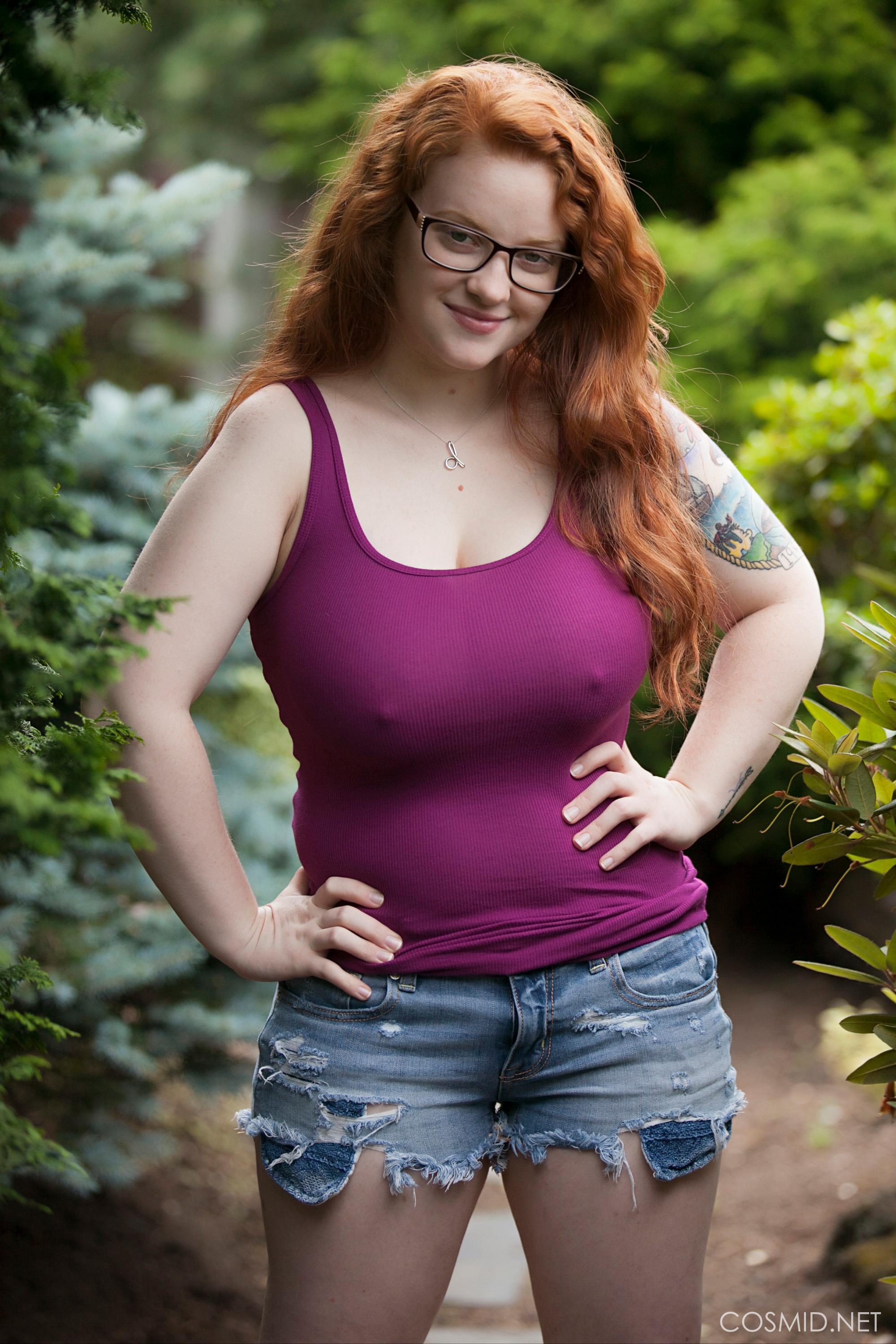 Chubby redhead with big tits Kaycee Barnes looks adorable in her glasses as  she gets nude